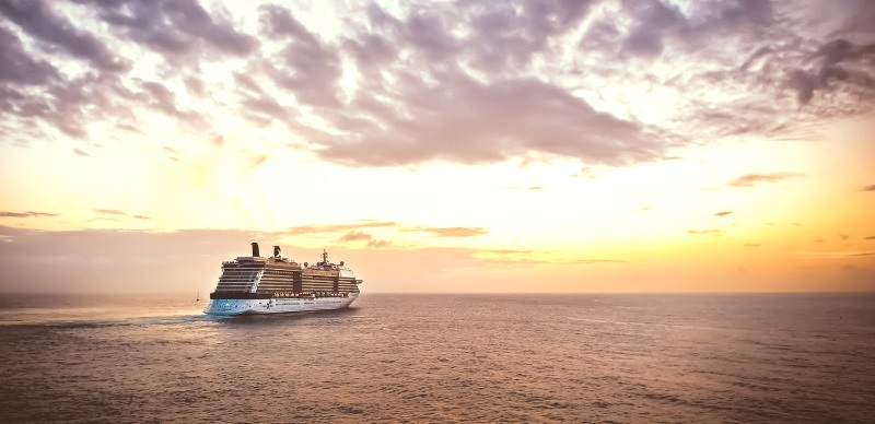 Cruise boat sailing into the sunset