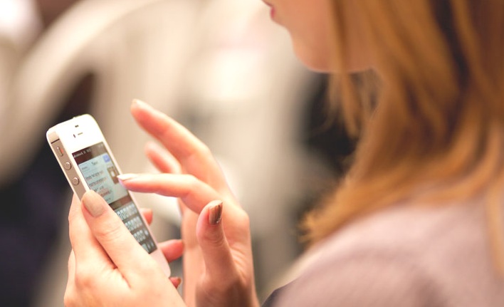 woman holding an iphone