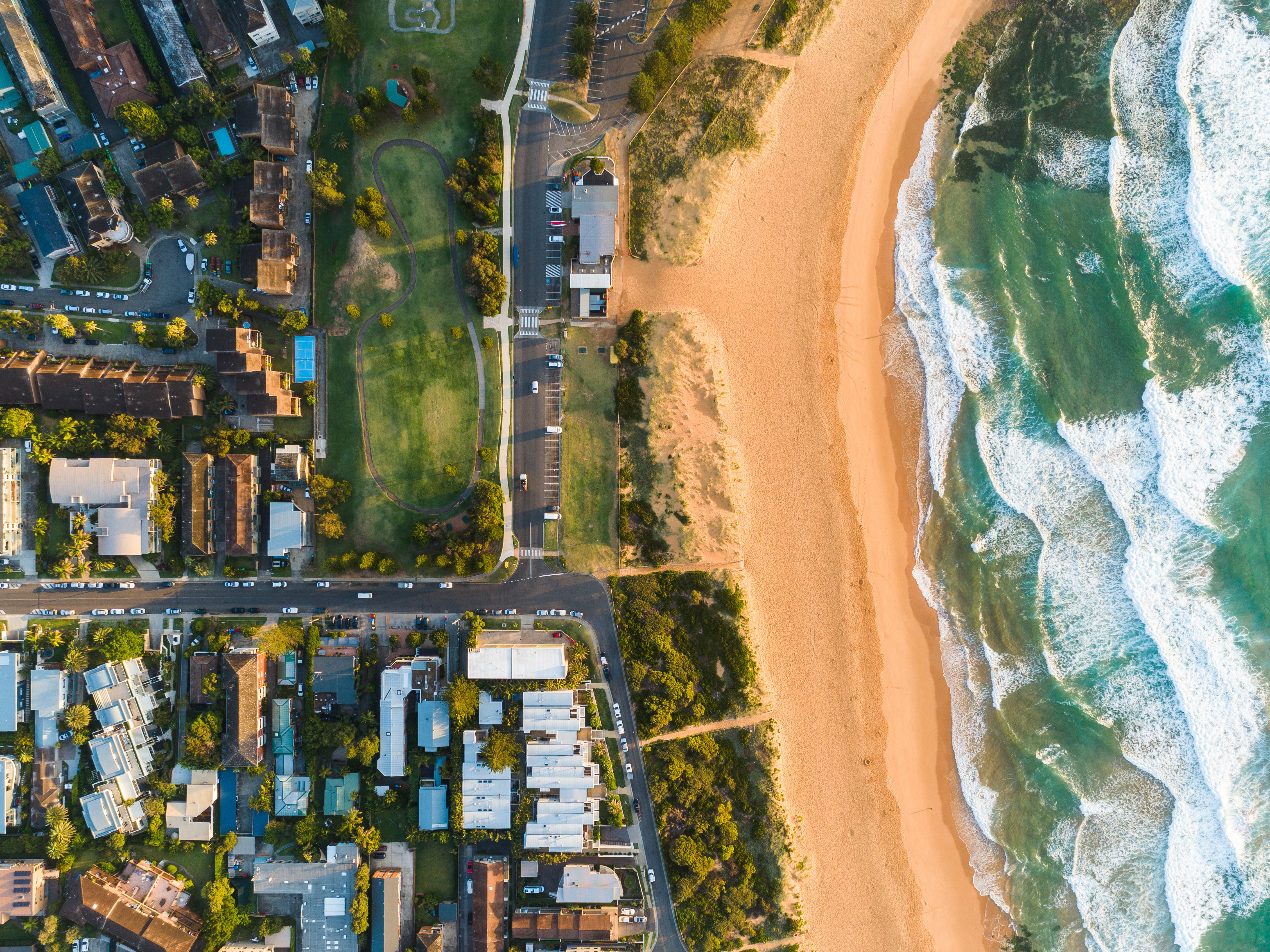 an aerial image of mona vale beach in sydney