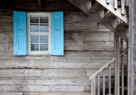 blue shutters wooden house